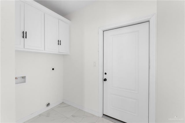 900 E 38th St, San Juan, TX 78589 - laundry room with marble finish floor, baseboards, hookup for a washing machine, electric dryer hookup, and cabinet space