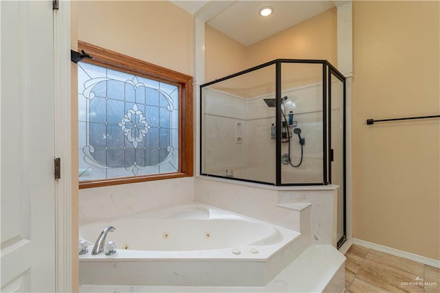 bathroom featuring tile patterned flooring and plus walk in shower