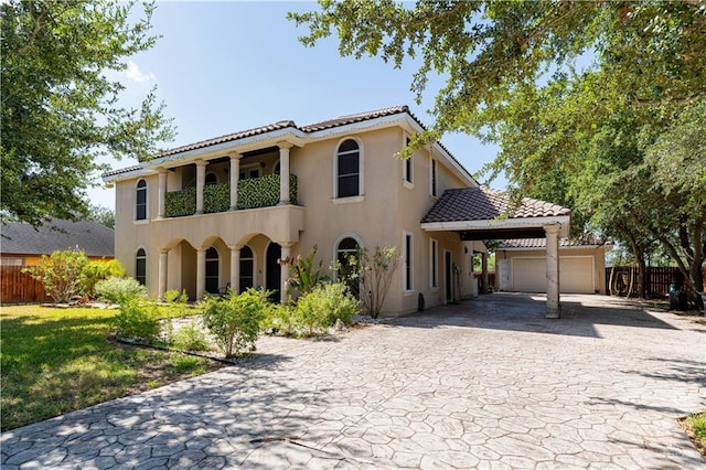 mediterranean / spanish-style house with a front yard