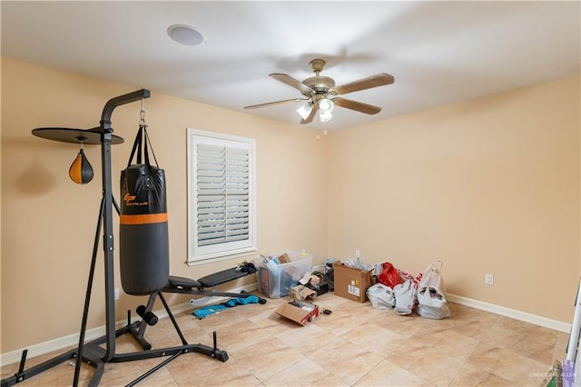 exercise room with ceiling fan