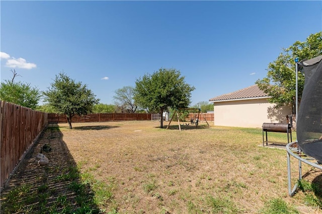 view of yard featuring a trampoline