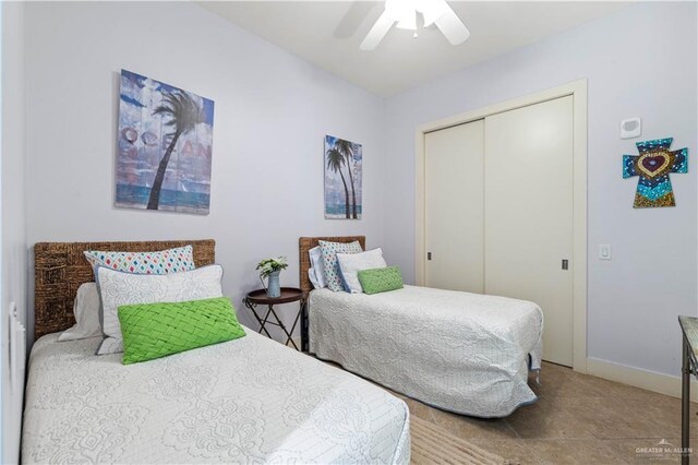 bedroom featuring a closet, a ceiling fan, and baseboards