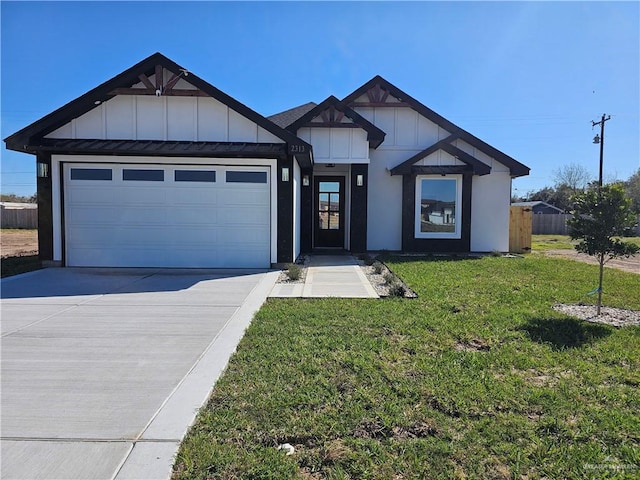 view of front of home featuring an attached garage, driveway, a front lawn, and board and batten siding