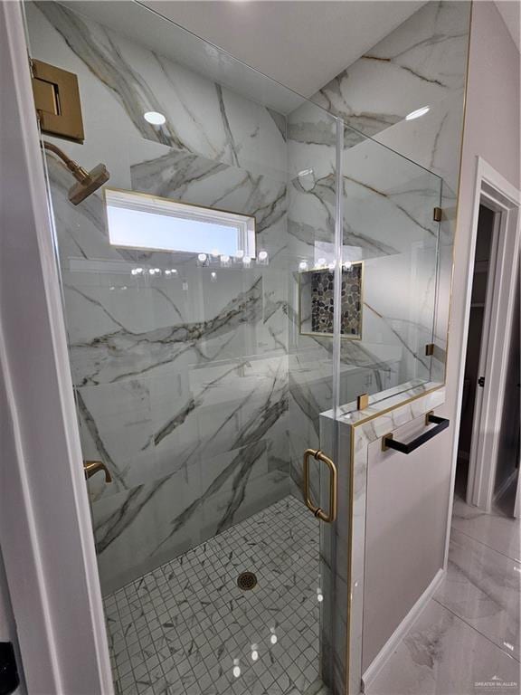 bathroom with marble finish floor and a marble finish shower