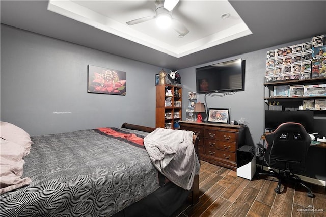 2729 Ashley Ct, Pharr, TX 78577 - bedroom featuring wood finished floors, a ceiling fan, and a raised ceiling
