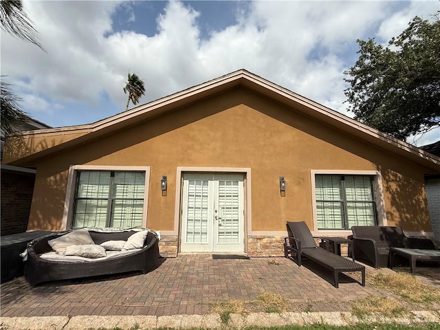 2729 Ashley Ct, Pharr, TX 78577 - rear view of property with a patio area, stucco siding, stone siding, and an outdoor hangout area