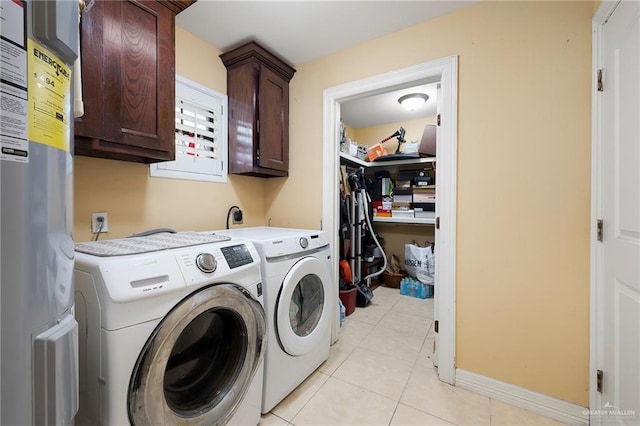 2729 Ashley Ct, Pharr, TX 78577 - laundry area featuring separate washer and dryer, baseboards, light tile patterned flooring, and cabinet space
