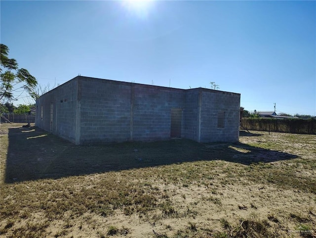 view of outdoor structure with a lawn