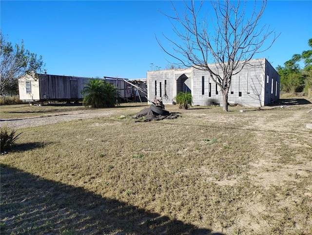 view of property exterior with a yard