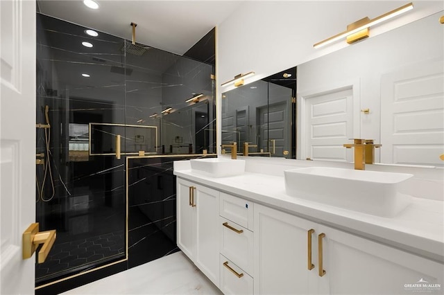 bathroom with vanity and a shower with shower door