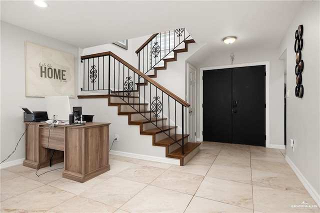 foyer featuring stairs, recessed lighting, and baseboards