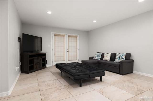 living area with recessed lighting, baseboards, and french doors