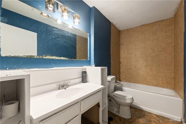 bathroom with tub / shower combination, vanity, and toilet