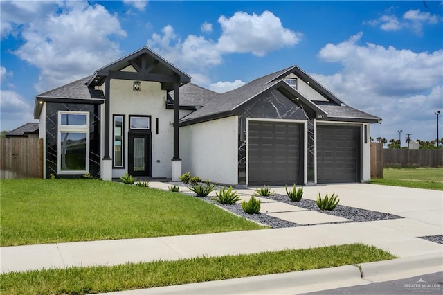 537 Kiwi St, Edinburg, TX 78541 - view of front of property with an attached garage, driveway, stucco siding, and roof with shingles