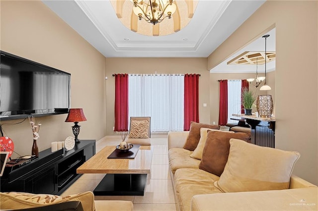 living room featuring an inviting chandelier, a raised ceiling, and light tile patterned flooring