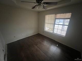 empty room featuring ceiling fan and wood-type flooring