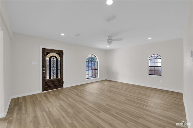 interior space featuring ceiling fan and light wood-type flooring