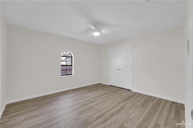 unfurnished room featuring ceiling fan and light hardwood / wood-style floors