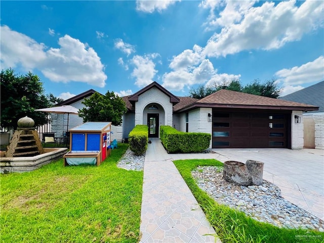 single story home with an outbuilding and a front lawn