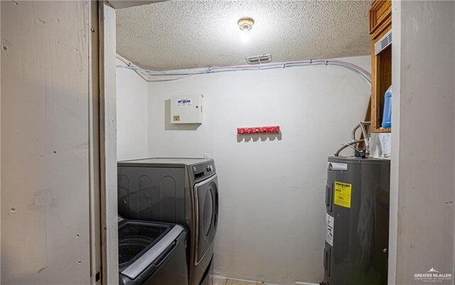 3300 N 20th St, Mcallen, TX 78501 - laundry area featuring washing machine and dryer and water heater