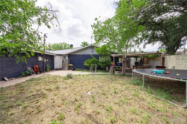 view of yard featuring a trampoline