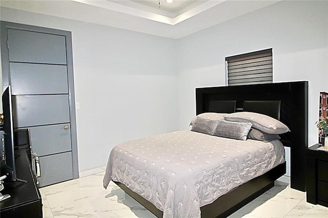 2209 David Ave, San Juan, TX 78589 - bedroom featuring baseboards, marble finish floor, recessed lighting, and a tray ceiling