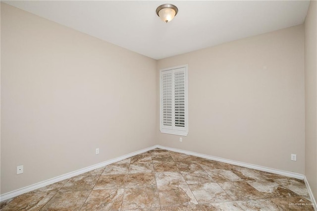 empty room with baseboards