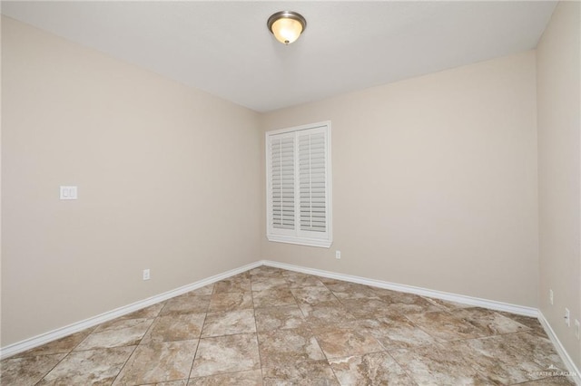 empty room with baseboards