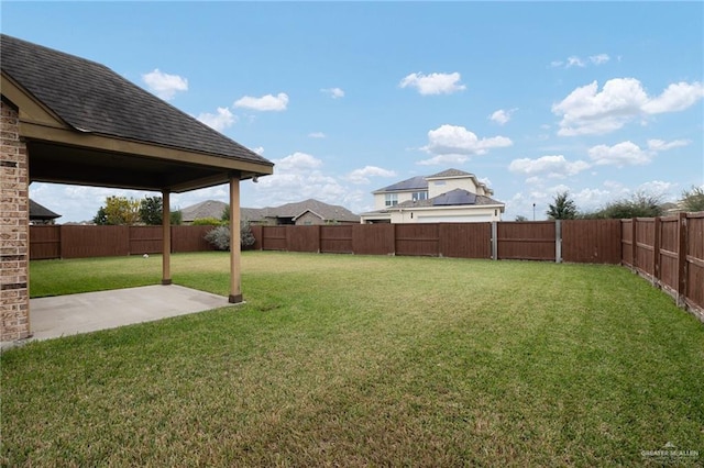 view of yard with a patio and a fenced backyard