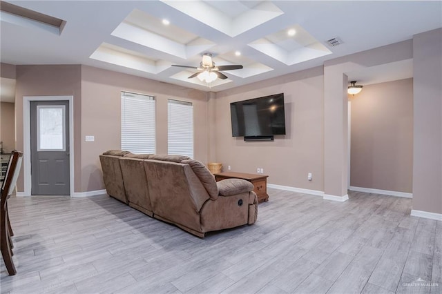 living room with beamed ceiling, ceiling fan, coffered ceiling, and light hardwood / wood-style floors