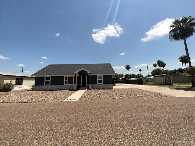 105 Lampshire Ln, Mission, TX 78572 - ranch-style house featuring concrete driveway and a shed