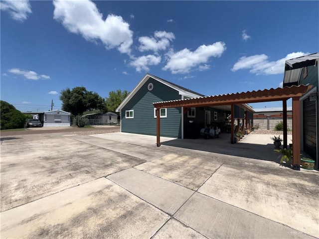 view of side of property with a carport