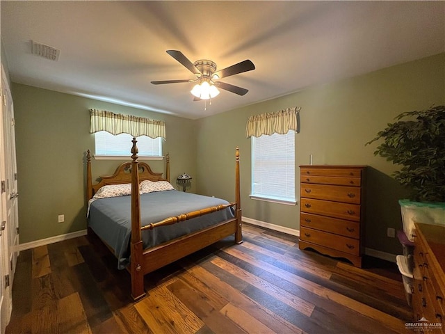 bedroom with ceiling fan and dark hardwood / wood-style floors