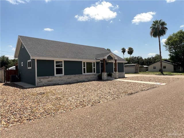 105 Lampshire Ln, Mission, TX 78572 - single story home with stone siding and roof with shingles