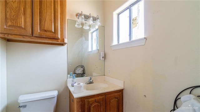 4706 N Trosper Rd, Palmhurst, TX 78573 - bathroom featuring plenty of natural light, toilet, and vanity