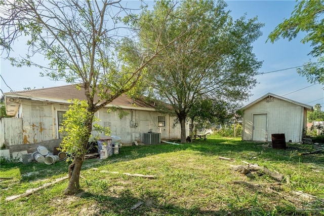 4706 N Trosper Rd, Palmhurst, TX 78573 - view of grassy yard with cooling unit, an outdoor structure, and a storage shed