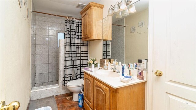 4706 N Trosper Rd, Palmhurst, TX 78573 - full bathroom with tiled shower, toilet, vanity, and tile patterned floors