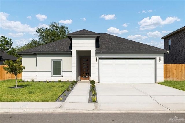 9206 N 25th St, Mcallen, TX 78504 - view of front of home with a shingled roof, an attached garage, and concrete driveway