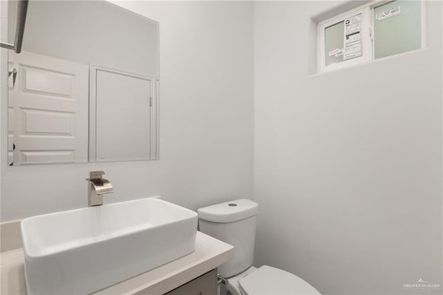 9206 N 25th St, Mcallen, TX 78504 - half bathroom featuring toilet and vanity
