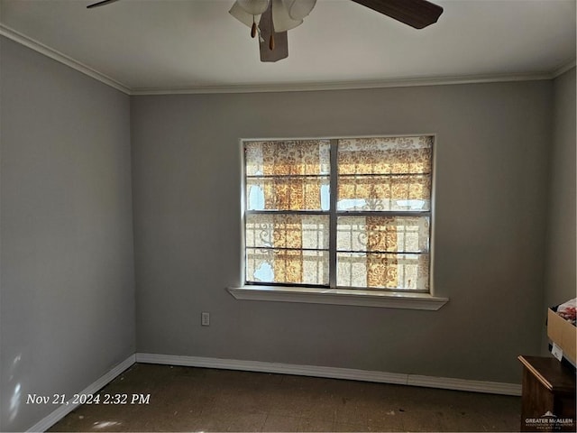 spare room featuring ceiling fan and crown molding