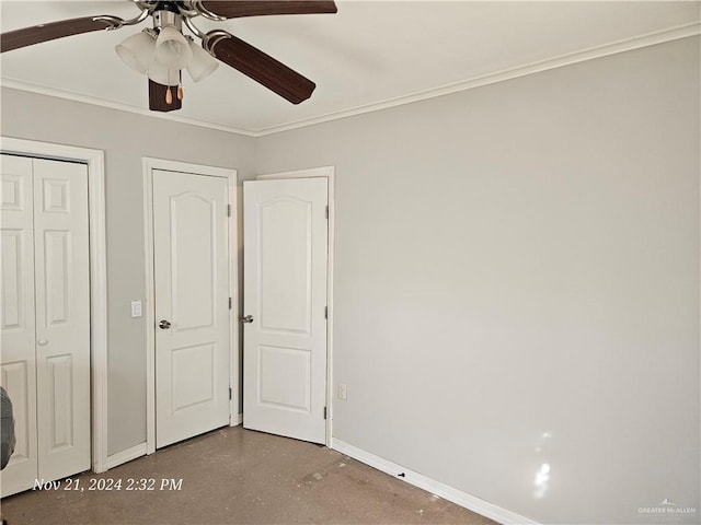 unfurnished bedroom with ceiling fan, concrete flooring, and crown molding