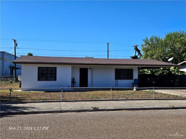 ranch-style home with a carport