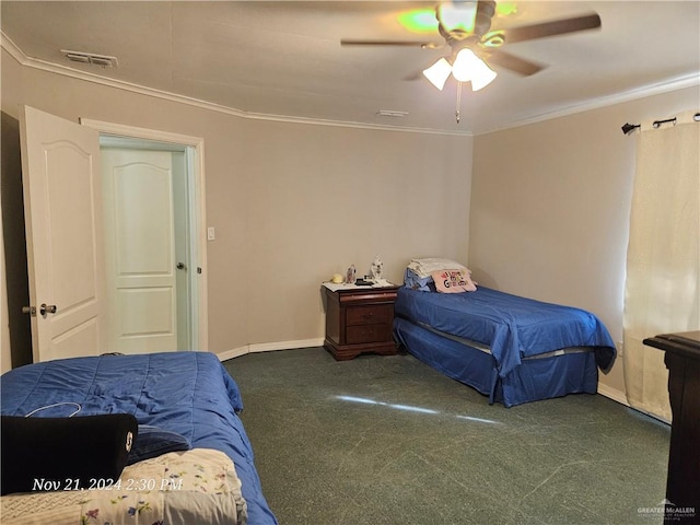 carpeted bedroom featuring ceiling fan and crown molding