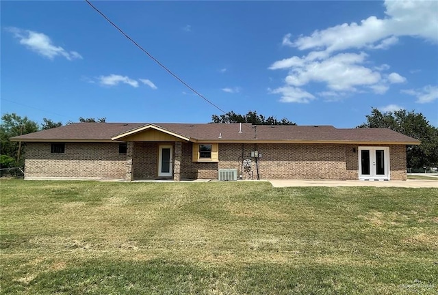 5307 Fm 493rd Rd, Donna, TX 78537 - rear view of house featuring french doors, a lawn, and brick siding