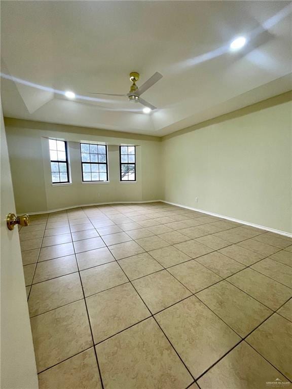 5307 Fm 493rd Rd, Donna, TX 78537 - spare room with a tray ceiling, a ceiling fan, plenty of natural light, tile patterned floors, and recessed lighting