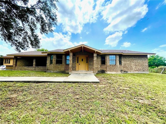 5307 Fm 493rd Rd, Donna, TX 78537 - ranch-style house featuring brick siding and a front yard