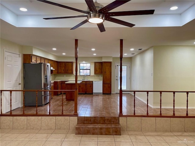5307 Fm 493rd Rd, Donna, TX 78537 - kitchen featuring stainless steel fridge, white dishwasher, tile patterned flooring, a center island, and open floor plan