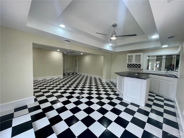 5307 Fm 493rd Rd, Donna, TX 78537 - kitchen with a raised ceiling, a ceiling fan, light flooring, white cabinets, and recessed lighting