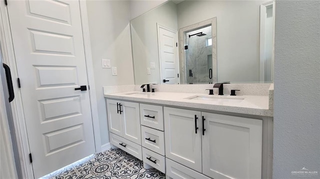 bathroom featuring a sink, tile patterned flooring, a stall shower, and double vanity