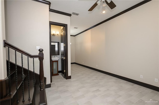 interior space with ceiling fan, stairs, baseboards, and crown molding